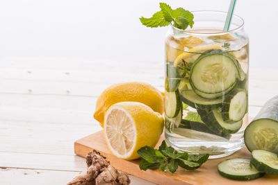 A glass of water with lemon, cucumber, and mint, symbolizing the importance of hydration for the immune system.