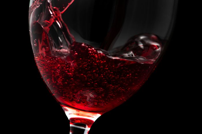 Close-up of red wine swirling in a wine glass